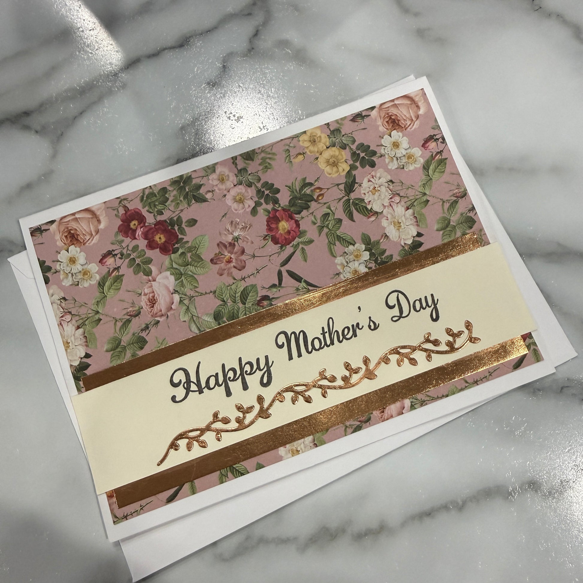 Floral Mother's Day card on a marble surface
