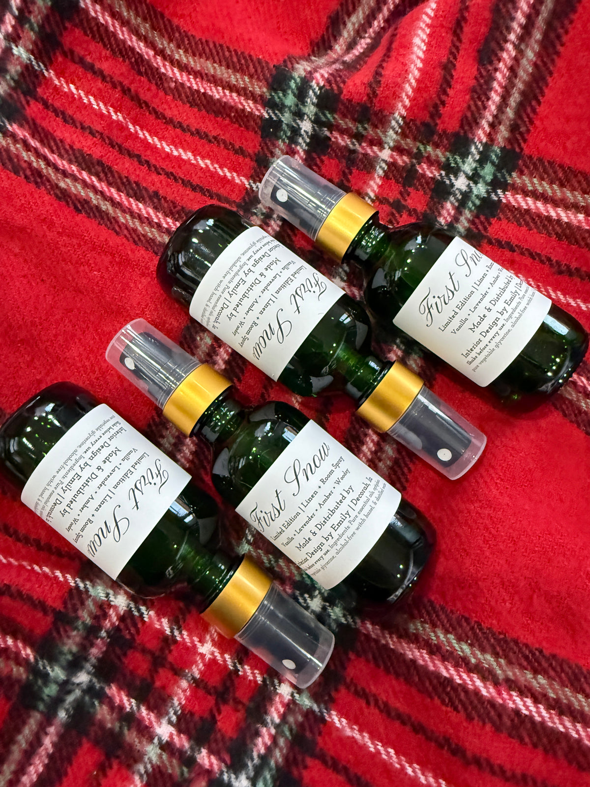 First Snow holiday room and linen spray in green glass bottle with lavender lemon and berry fragrance