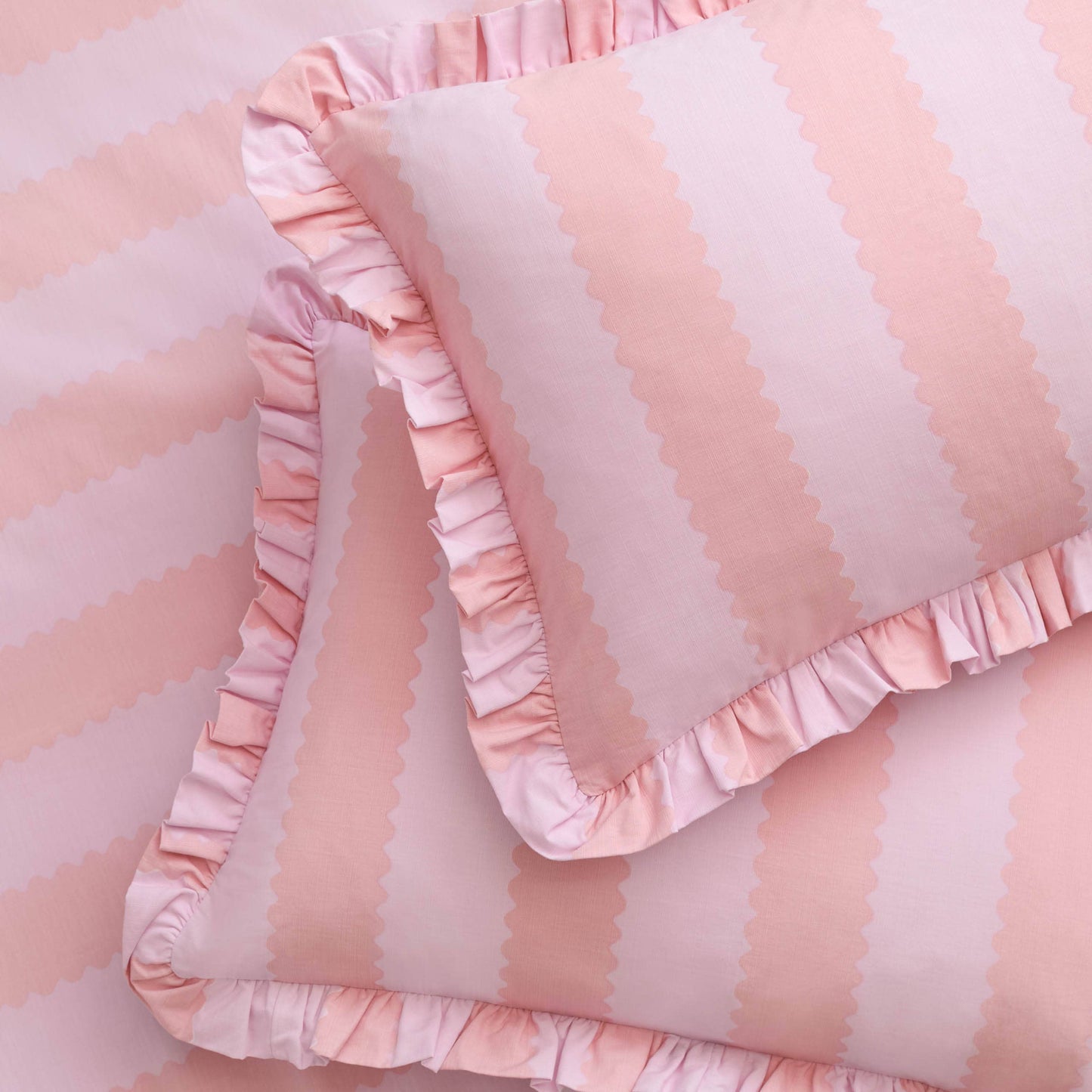 Pink and white striped fabric with ruffled edges