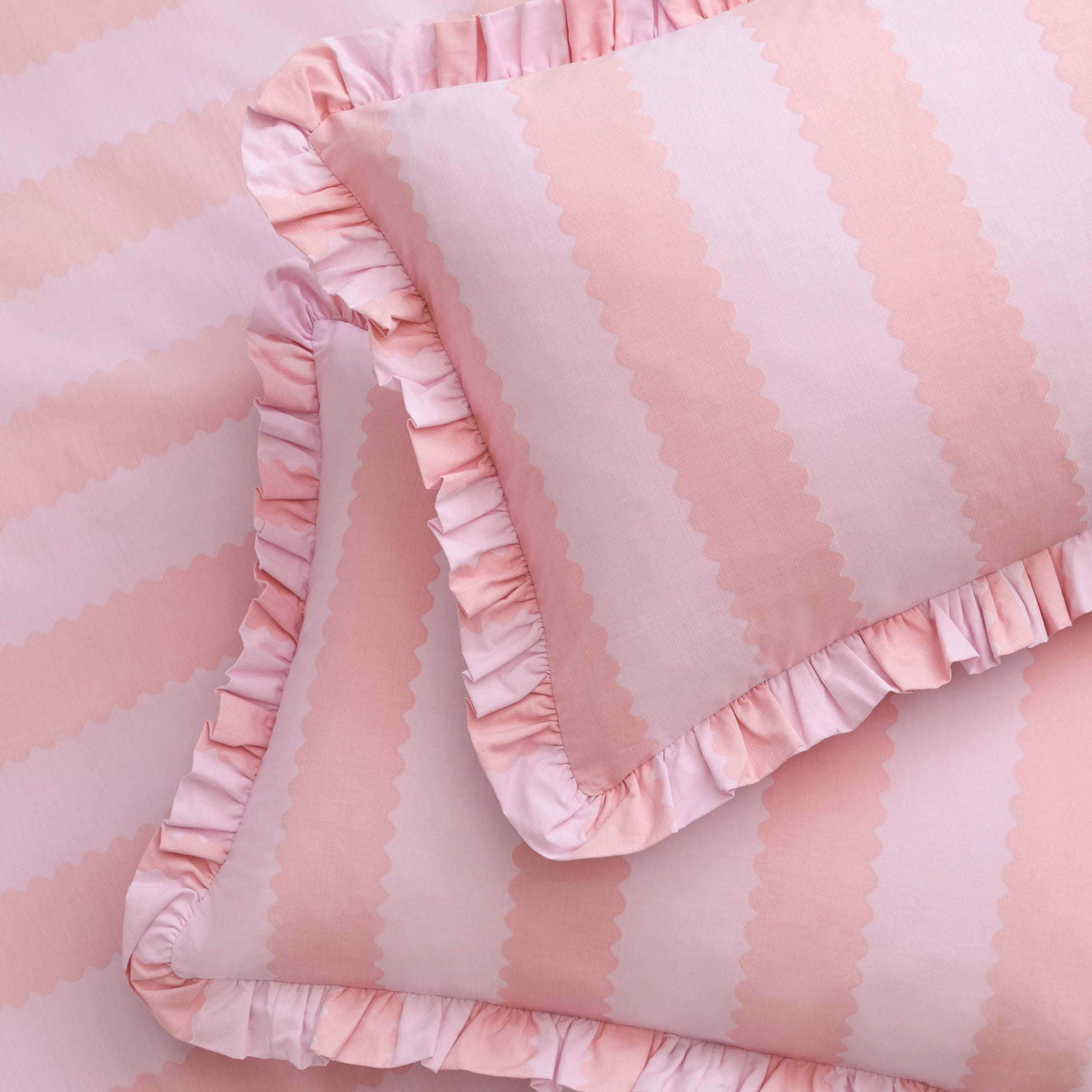 Pink and white striped fabric with ruffled edges