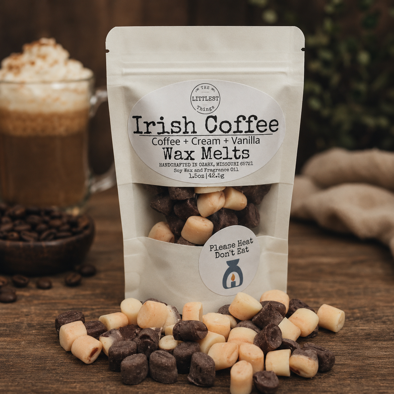 Packaging of Irish Coffee wax melts with a cup of coffee and coffee beans in the background.